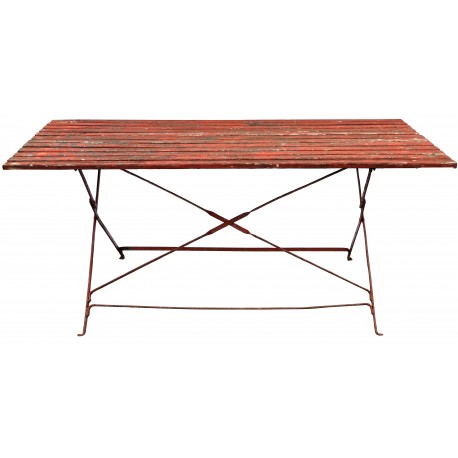 Ancient wooden table with legs in wrought iron