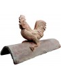 The cock on an ancient roof tile