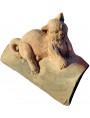 Terracotta cat on the ancient roof tile