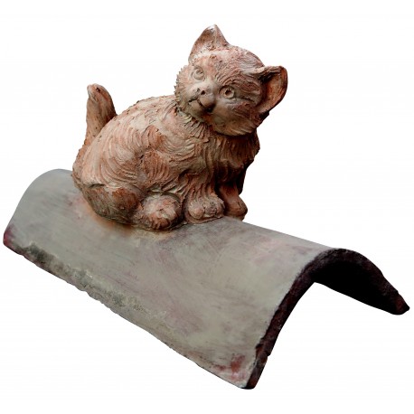 Terracotta cat on the ancient roof tile