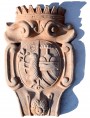 Terracotta coat of arms with IHS and Peace Lamb and Della Gherardesca tree