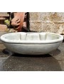 White marble sink with two volutes