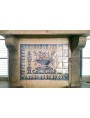 Limestone fireplace with Portuguese maiolica panel