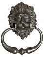 A lion's head door knocker with handle castiron
