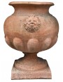 Globular vase with masks