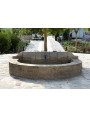 Large fountain in limestone with one faucet
