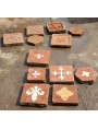 Selection of tiles with marble tarsia and graffiti tiles