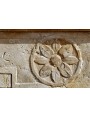 Bellavigna's limestone fireplace with two rosettes