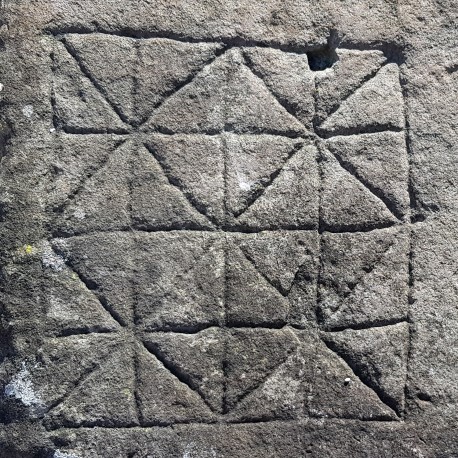 Large ancient stone with engraving of the Nine men's morris