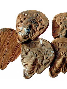 ancient Tuscan terracotta masks