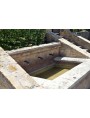 Large fountain in limestone with three bronze faucet