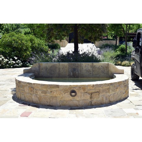 Large fountain in limestone with one faucet