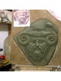 Forming of the bas-relief in raw clay