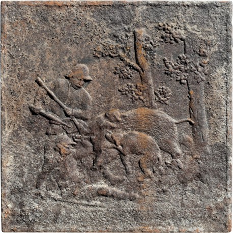 Ancient fireplace with wild boar and dogs hunting scene