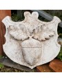 The original coat of arms hand-made in stone