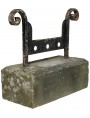 Forged-iron boot scraper mounted on stone
