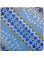 Ancient majolica tile blue, white and yellow on a light blue background