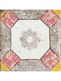 Piastrella antica di maiolica con fiore