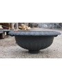 Cast iron wall fountain with scallopped basin
