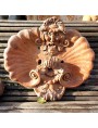 antique wall frieze with mask and shell