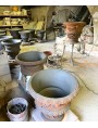 Six freshly trodden and partly finished vases are ready to begin the long drying period