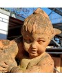 Little girl with Dolphin ancient terracotta statue