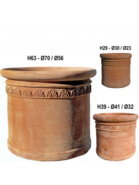 three terracotta cylinders with an ornate border