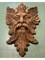 copy of an ancient mask in terracotta