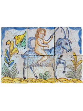 A pair of Sicilian majolica panels, puttos and goats