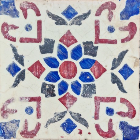 Old majolica tile with center flower