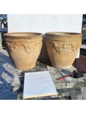 A pair of ancient Neapolitan festooned flower vases