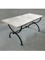 Garden table in Limestone and forged-iron