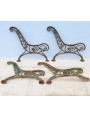two pairs of legs of ancient cast iron benches