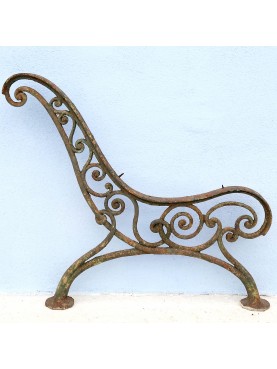 two pairs of legs of ancient cast iron benches