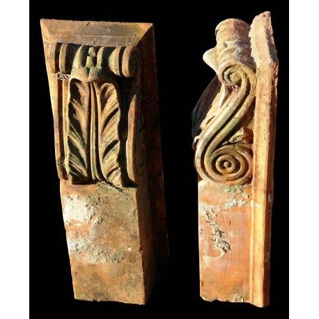 Two small terracotta brackets