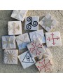 Antique tile in white Carrara marble with Maltese cross in high relief
