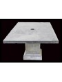 Stone and concrete table with umbrella holder hole