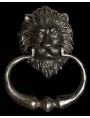 A lion's head door knocker with handle castiron